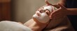 © Dmy - The relaxing facial treatment enhancing beauty and rejuvenation in a serene spa environment.