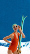 © master1305 - Minimalist pop art collage. Woman in orange swimsuit posing with skis on snowy slope. Concept of bold fashion statement, travel guide irony, and high-impact winter brand campaign.