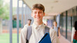 © Monkey Business - Portrait Of Smiling Male High School Or Secondary Student With Backpack Outside Classroom
