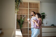 © Migma_Agency - Happy couple enjoying morning coffee in modern apartment