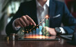 © VGX Ultra - Businessman Analyzing Growth Trends with Digital Graph on Tablet Surrounded by Coins and Financial Data in Modern Office