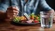 © Johannes - healthy eating balanced diet food and people concept  close up of male hands having meat and vegetables for dinner with fork and water glass no logos no brands ar 169