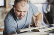 © Branimir - Male Carpenter Working with Wood