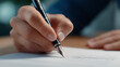 © Kateryna - Signing a Contract with a Fountain Pen in Focused Lighting