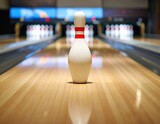 Single bowling pin on wooden alley lane