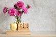 © MaskaRad - Pink asters, apple and calendar showing september 1st celebrating back to school and knowledge day
