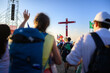 © Adam Ján Figeľ - A girl walking past and greeting groups of young people at the Tor Vergata camp during the Youth Jubilee with Pope Leo XIV.