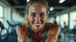 © shehroz khan - Smiling portrait of a fit young brunette woman at the gym, looking active and healthy, woman, athletic, smiling, fitness, workout, gym, exercise, muscular, posing, looking at camera