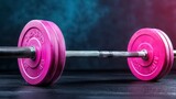 Close-up view of a vibrant pink dumbbell on a dark surface highlighting fitness and strength training elements