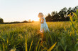 © nataliaderiabina - Blond little girl running on meadow during sunset. Photography of only child.