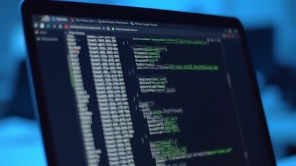 Close-up perspective of a computer screen displaying lines of programming code for software development.