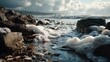 © Kitsada - Serene rocky shoreline with gentle waves and foam crashing over stones under cloudy sky du daytime, peaceful coastal landscape scene
