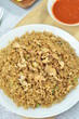 © Afif - Delicious fried rice with egg, chilli, crackers and green onion, Indonesian dish.