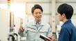 © Stingray_Japan - 指導と育成：工場で設備について新入社員に説明する日本人男性社員