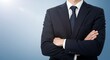 © ikhsan - Confident Businessman in Suit with Arms Crossed Against Blue Background