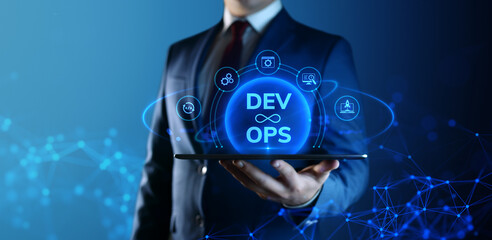 Businessman holding tablet with Dev Ops Development Operations icons on screen