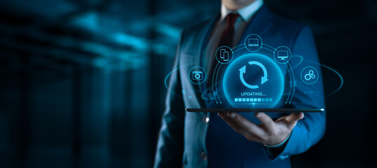 Businessman Holding Device with Update Icons on Screen. Software Updating or Upgrade Concept