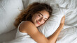 © Atchariya63 - Young woman sleeping peacefully in white bed with soft pillow, relaxed and comfortable, enjoying restful sleep and calm moment