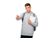 © practice  - Young student with backpack pointing and holding notebook on transparent background, PNG