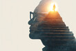 © Werabhat - Silhouette of a person climbing stairs inside a human head profile symbolizing progress and enlightenment.