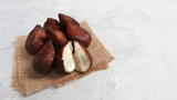 Snake Fruits or Salak Pondoh, Salacca or Sala (Salacca zalacca) isolated on grey background.Tropical fruit