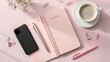 © StockVibes - Flat lay of a pink notebook phone pen coffee and stationery
