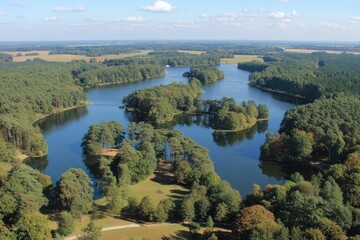 Naklejka na meble Scenic aerial view of a winding lake surrounded by forests