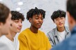 © World of AI - Group of diverse young men engaged in a discussion, showcasing teamwork and collaboration in a modern learning environment with whiteboard notes in the background