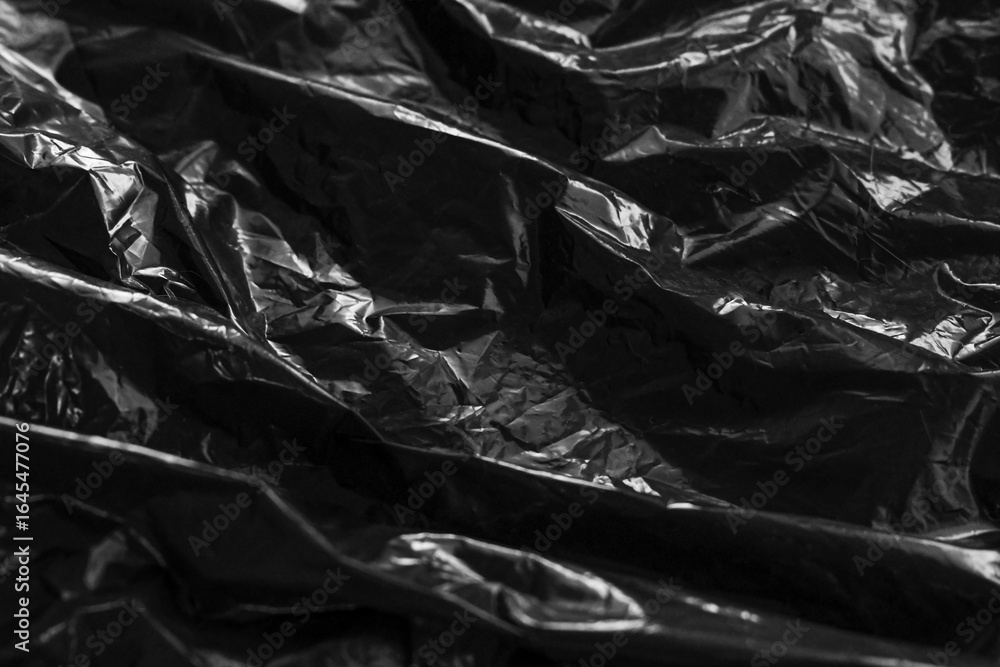 Black plastic bag texture background. Reuse and Recycle concept.