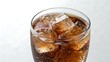 © Piyar - Refreshing cola beverage with ice cubes in a clear glass on a bright surface
