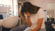 © Monkey Business - Depressed Teenage Girl Sitting On Bed At Home With Head In Hands