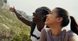 © peopleimages.com - Women, friends and selfie with hiking, mountains and show location on live stream with smile in nature. Girl, happy and photography with landmark, point and outdoor with social media for tourism