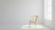 © Ace13 - A single wooden chair stands in a sunlit corner of an empty, minimalist white room near a window.