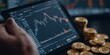© kwanchaift - Digital tablet displaying stock market analysis with cryptocurrency coins showcasing financial investment trends in a professional workspace setting