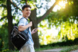© zinkevych - Smiling teen with a backpack looking contented and happy