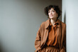 © Tamar - individual confidently practices their pronunciation with ai tool standing against clean ultrabright background