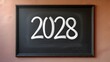 © narumiaegis - 2028 written in chalk on a blackboard, representing the future year, progress, and new beginnings with a clean slate