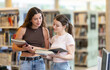 © JackF - Two female student friends studying for exams together in the university library