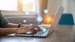 © Nimra - Stay connected with clients using modern social media network on laptop in home office
