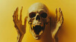 © Tohamina - A screaming skull with hands framing it against a yellow background