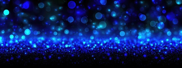 Dark blue bokeh background with glittering particles