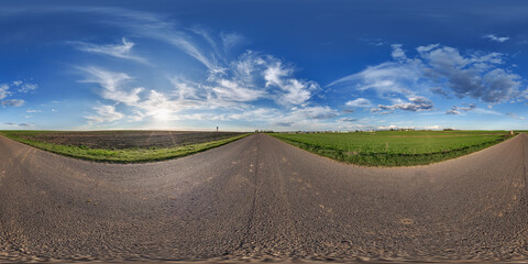 Wall Mural - hdri 360 panorama view on crossroads of gravel country roads among fields with clouds in sky in equi