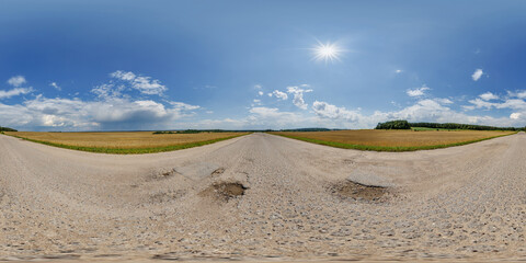 Wall Mural - hdri 360 panorama view on crossroads of gravel country roads among fields with clouds in sky in equi