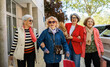 © Westend61 - Senior women enjoying a day of shopping together in an urban setting