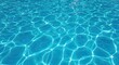 © Rajab - Captivating clean blue pool water surface with brilliant sunlit ripples creating a serene and refreshing summer atmosphere for relaxation and recreation