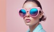 © Anupong - Closeup Portrait of a Young Woman in Pink Sunglasses and Light Blue Jacket