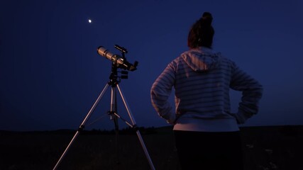 Wall Mural - amateur astronomer using telescope for watching stars, moon, planets and other celestial objects fro