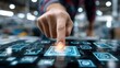 © Ndoomyim - A close up shot of a human hand with a finger extended gently touching the screen of a modern sleek laptop computer illustrating the intersection of human interaction and digital technology.