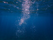 © boulham - Bubbles under the sea in the crystal clear green sea water. Mediterranean sea bubbles, Air bubbles underwater rising to water surface, natural scene, bubbles under water, bubble undersea, Blue water.