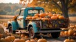 © Lasvu - A vintage blue truck loaded with pumpkins in an autumn field, surrounded by fallen leaves and more pumpkins, capturing a seasonal pumpkin harvest scene.
